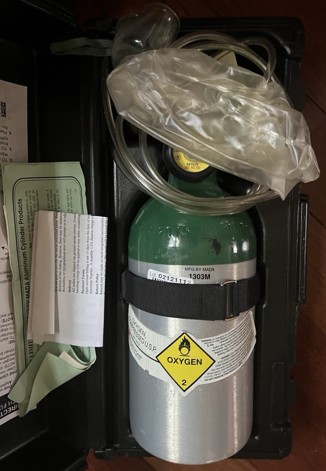 Mada portable emergency oxygen unit, model 1303M housed in a black plastic case.